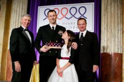 Gary Sinise and John Vigiano present a Hope & Courage Award to an honoree